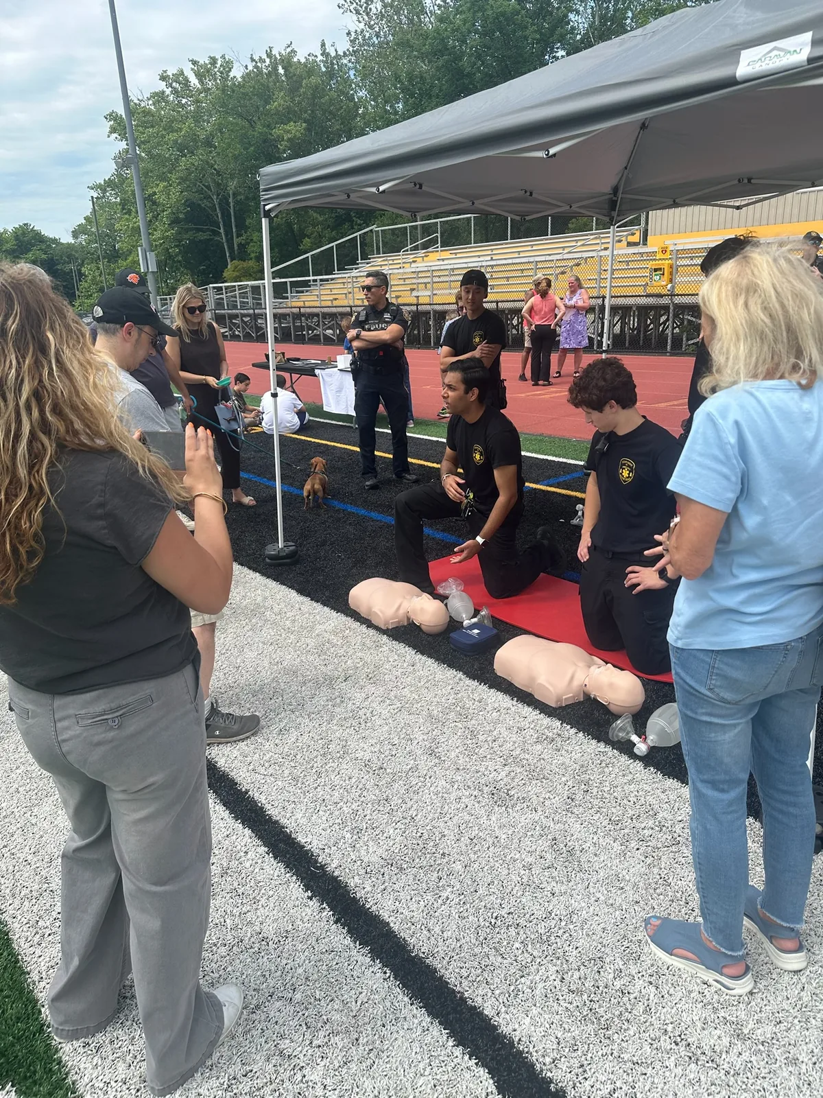 Cedar Grove EMS members leading a public CPR demonstration