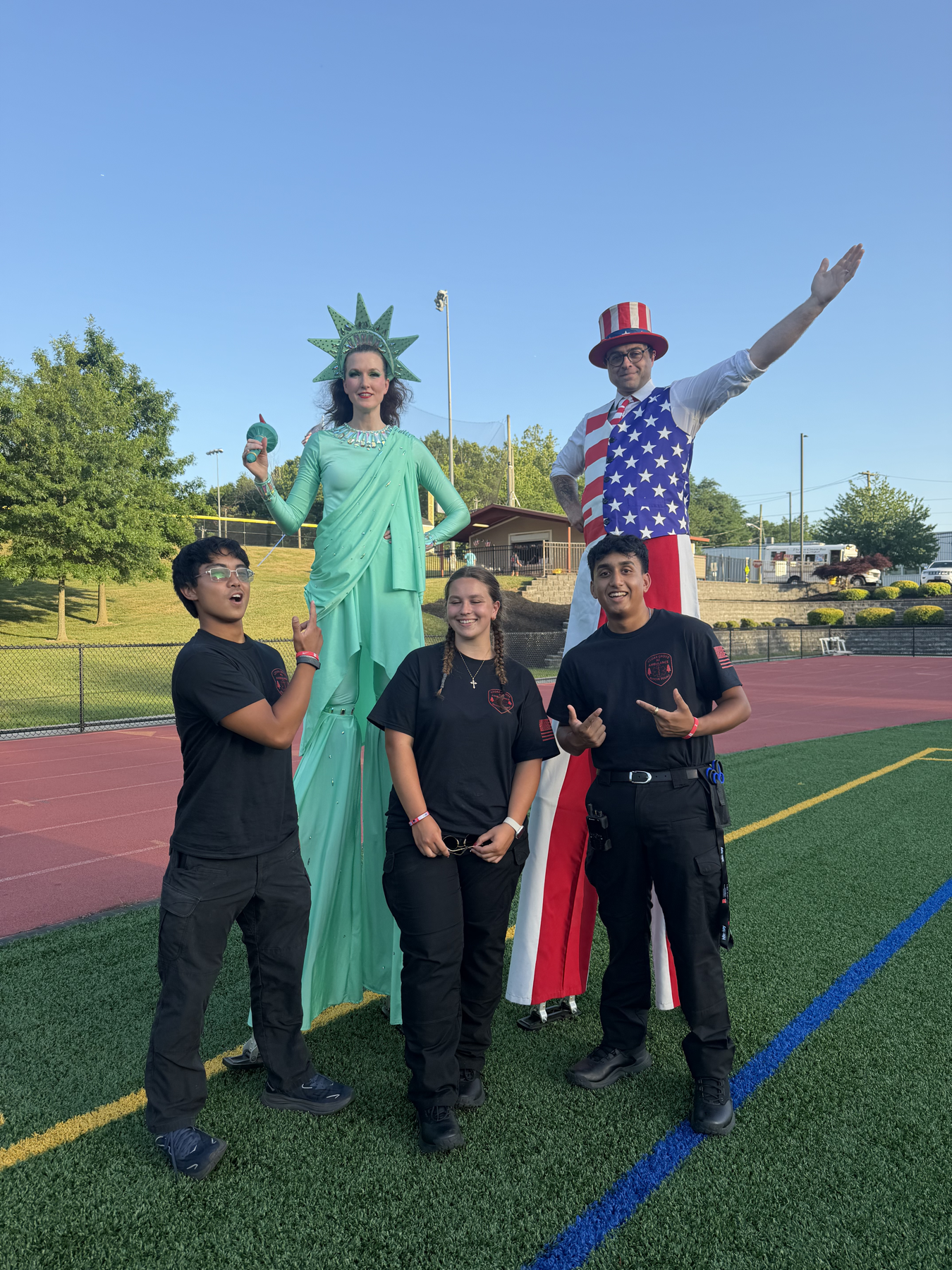 Cedar Grove EMS members with Fourth of July performers at a community event