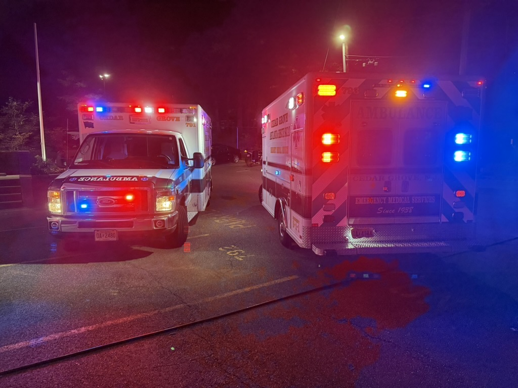 Ambulances staged at night.